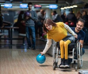 Disabled woman in a wheelchair bowling